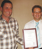 Gary Friend (right) receiving his certificate of presentation from Johan van Jaarsveldt (SAIMC President)